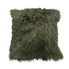 a green furry pillow on a white background