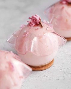 three pink desserts sitting on top of each other