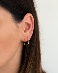 "Beautiful and classy, these tiny hoop earrings are adorned with a dainty baguette charm. Layer these versatile huggie hoops with other delicate earrings to create your favourite ear stack. * Sold individually (1 earring) or by pair (2 earrings). Both options are available on the dropdown menu. * Available with an emerald green cubic zirconia gemstone or a white cubic zirconia gemstone. Both options are available on the dropdown menu. * D E T A I L S * ∙ Material: .925 Sterling Silver or 18K Gol Dainty Green Huggie Hoop Earrings, Minimalist Green Huggie Hoop Earrings, May Birthstone Small Hoop Huggie Earrings Gift, May Birthstone Huggie Earrings Gift, Dainty May Birthstone Hoop Earrings, May Birthstone Huggie Hoop Earrings, Ear Huggies, Gold Huggie Earrings, Dainty Gold Earrings