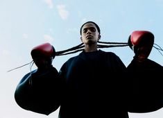 a man with two boxing gloves on his head