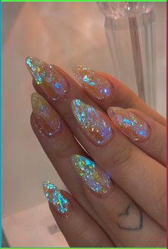 I'm excited to experiment with glamorous and festive nail designs that capture the celebratory spirit of the occasion. I'm drawn to sparkly colors like gold, silver, and midnight blue, perfect for ringing in the new year with style. Incorporating elements such as glitter accents, fireworks patterns, and elegant metallics will make my New Year nails stand out, adding a touch of sparkle and sophistication to my holiday look. New Year Nail, New Year Nails, Nye Nails, Festive Nail Designs, Ringing In The New Year, Glittery Nails, Top Nail