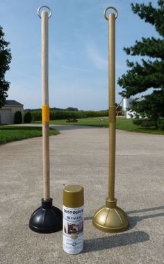 there are two poles that have been placed next to each other on the ground and one has a spray bottle in front of it