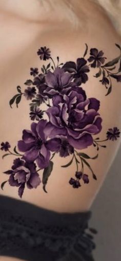 a woman's back with purple flowers on her shoulder and the words visual search below it