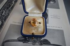 Vintage circa 1980 ring in 18-carat yellow gold. It features an oval citrine of approximately 3.5 carats (13 x 9 x 6 mm). Weight: 4.9g Size: 51 FR (5.75 US - L UK) - Resizing offered Metal: 18 carat gold Stone: Citrine Citrine Weight: approx. 3.5 carats Hallmark: Eagle's head (18 carat gold) Top: 15 x 12 mm Antique Oval Sapphire Ring For Formal Occasions, Estate Oval Ring Stamped 14k, Vintage Yellow Gold Signet Ring With Center Stone, Elegant Yellow Hallmarked Signet Ring, Yellow Gold Oval Estate Rings, Estate Style Oval Yellow Gold Rings, Oval Yellow Gold Estate Rings, Oval Heirloom Topaz Ring For Formal Occasions, Formal Orange Oval Rings