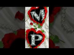 the letter p is made up of red roses and white letters that spell out love