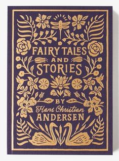 a blue and gold book cover with floral designs on the front, featuring fairy tales and stories by hans christian anderson