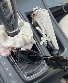 sunglasses and other items are sitting in the back seat of a car, on display