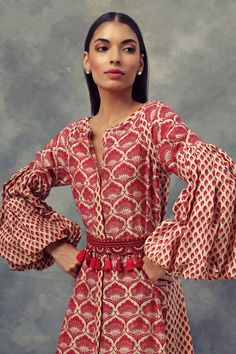 Featuring a Bindu & leaf print dress with puff sleeves & handcrafted thread embroidered tasseled belt. Fabric: Chanderi Silk Color: Red Care: Dry Clean Only About the DesignerBhumik... Luxury Cotton Silk Dress For Festive Occasions, Luxury Spring Traditional Wear With Printed Motifs, Luxury Traditional Drape Churidar With Printed Motifs, Luxury Traditional Wear With Woven Motifs, Luxury Traditional Pattern Dress For Diwali, Luxury Red Block Print Traditional Wear, Luxury Silk Puff Sleeve Dress For Women, Luxury Traditional Wear With Motifs For Women, Luxury Dresses With Woven Motifs For Festivals