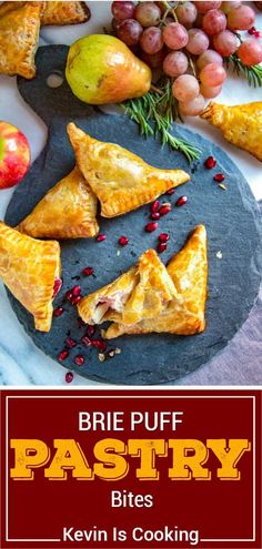 there are some pastries on the plate with fruit and vegetables in the background that says brie puff pastry bites keven is cooking