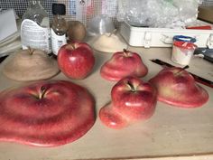 some apples are sitting on a counter top