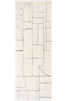 a white rug with black lines on the side and one line drawn across it in different directions