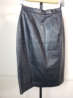 Discover Timeless Elegance: Elevate your wardrobe with this exquisite Vintage Wilson's Leather Black Skirt, a testament to classic sophistication and enduring style. Crafted with the modern woman in mind, this skirt blends the allure of vintage with the functionality of contemporary design. Key Features: Premium Quality: Made from the finest leather and lined with soft polyester, this skirt offers both luxury and comfort. Its flawless condition and minimal signs of wear and tear reflect its exceptional quality and craftsmanship. Perfect Fit: Tailored to fit a Women's Size 8, with a waist measurement of 25 inches and approximately 38 inches at the hips, this skirt is designed to flatter your figure while ensuring a comfortable fit. Elegant Details: The skirt measures 24 inches from the wais Diy Fashion Accessories, Womens Skirts, Leather Midi Skirt, Black Leather Skirts, Leather Pencil Skirt, Vintage Rock, Leather Shirt, Rock Design, Fashion Tips For Women