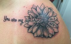 a sunflower tattoo with the words you are my sunshine on it's back