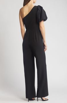 A shoulder-baring neckline and fluttery puff sleeve frame a party-ready jumpsuit cut from comfortable stretch crepe. 61" length; 31" inseam; 24" leg opening (size 8) Hidden side-zip closure One-shoulder neck Single short sleeve Partially lined 88% polyester, 12% spandex Dry clean Imported Elegant One-shoulder Jumpsuits And Rompers For Date Night, Elegant One-shoulder Jumpsuits For Date Night, Elegant Short Sleeve Formal Jumpsuits And Rompers, Off-shoulder Jumpsuits And Rompers For Evening Spring Events, Formal Off-shoulder Jumpsuits And Rompers, Fitted Off-shoulder Jumpsuit For Workwear, Chic Off-shoulder Evening Jumpsuits And Rompers, Strapless Off-shoulder Jumpsuit For Spring Formal, Formal Spring Strapless Off-shoulder Jumpsuit