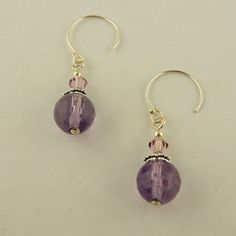 Made in the USA East of Eden Chakra Intuition Sterling Silver Hoop earrings w/ 8mm faceted round Amethyst & 4mm genuine Swarovski light amethyst crystal beads Sterling silver hoop Sterling silver bead caps Closed my brick and mortar store. My loss is your gain. Check my other auctions and listings for more Celtic and Irish jewelry. Listing lots of beads and findings as well so you can create your own jewelry. Check out my other items! Insured USPS shipping in a padded envelope with tracking number On Jan-15-16 at 12:44:04 PST, seller added the following information: Track Page Views With Auctiva's FREE Counter Nickel-free Round Purple Earrings, Lavender Round Jewelry With Faceted Beads, Hypoallergenic Purple Round Bead Earrings, Adjustable Faceted Round Bead Earrings, Faceted Amethyst Round Jewelry, Round Crystal Earrings With Faceted Beads, Lavender Amethyst Round Earrings, Purple Gemstone Round Bead Earrings, Round Faceted Beads Earrings As Gift