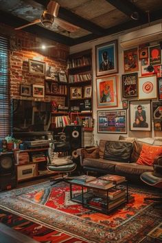 a living room filled with furniture and lots of pictures on the wall above it's windows