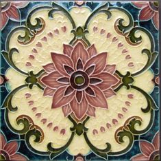 an artistic tile design with pink flowers and green leaves on the bottom half of it