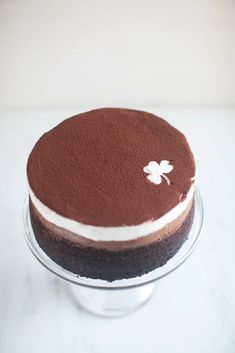 a chocolate cake sitting on top of a glass plate