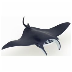 a black and white toy whale with its mouth open