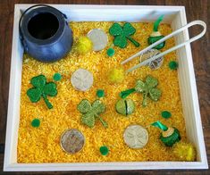 a tray filled with rice and shamrock decorations