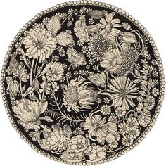 a black and white plate with flowers on it