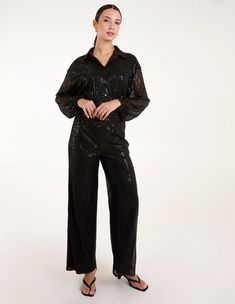 Born to boogie in style! These flared sequin trousers are super chic. Team with a sheer blouse and court heels and be sure to sparkle into the night. 100% Polyester Made In China Hand wash only Wide flare legElasticated waistUnfastened Model wears a size: SModel height: 5ft 9.5 / 176cm Sequin Trousers, Court Heels, Blouse Sale, Into The Night, Knee Dress, Curve Dresses, Family Outfits, Sheer Blouse, Black Sequins