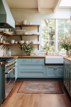 a kitchen with blue cabinets and wooden floors