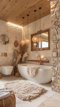 a large bathroom with stone walls and flooring