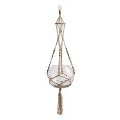 a hanging glass bowl with rope and tassels on the bottom is shown in white