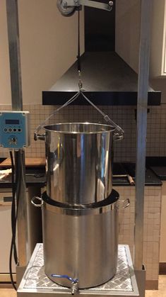 a large metal pot sitting on top of a counter