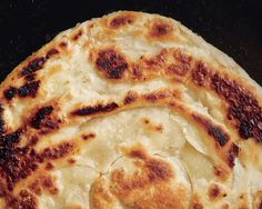 an uncooked pizza sitting on top of a pan