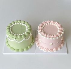 two cakes sitting side by side on top of a white countertop, one is pink and the other is green