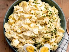 an image of a bowl of food with boiled eggs on the side and garnished with parsley