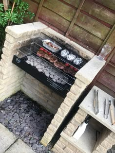 an outdoor grill with food cooking on it