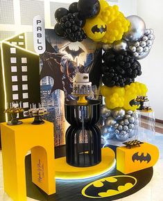 balloons and batman decorations are on display in the lobby