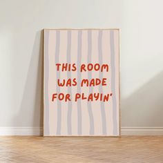 this room was made for playin'poster on the wall in an empty room