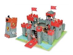 an image of a toy castle with flags on the front and back sides, including a flag