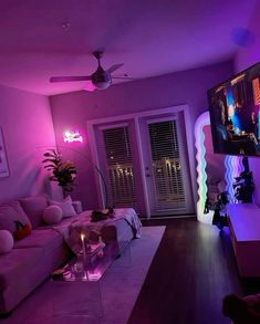 a living room filled with furniture and a flat screen tv