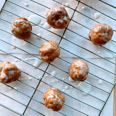 some donuts are sitting on a cooling rack