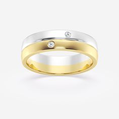 two tone gold and silver wedding ring with diamond set in the center, on a white background