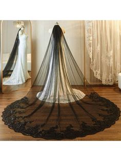 a wedding veil is shown in front of a mirror