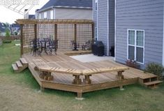 a wooden deck in front of a house