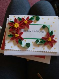 a handmade holiday card with poinsettis on it