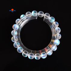 "Check out our Coupon Codes Below! Material: Clear Mystic Aura Quartz Shape: Matte Frosted Round Color: Rainbow, Iridescent Size: 10mm - 20 Beads Per 7.5\" Bracelet 8 mm - 25 Beads Per 7.5\" Bracelet Hole Size: Approx 1.0mm Note: -Gemstone bead sizes are approximate and may have a +/- 0.5mm difference. -Gemstone bead drill hole sizes are approximate and may have a +/- 0.2mm difference. Use our Coupon Codes for Big Savings! 10% off when you spend $50LRC10 15% off when you spend $100LRC15 20% off Iridescent 8mm Round Bead Jewelry, Iridescent Round Bracelets With 8mm Beads, Iridescent Bracelets With 8mm Beads, Iridescent Round Bead Bracelets, Rainbow Iridescent, Bead Sizes, Aura Crystals, Color Rainbow, Aura Quartz