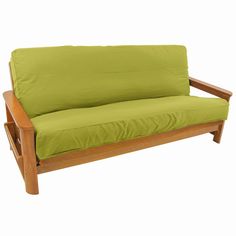 a green futon couch with wooden frame