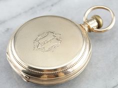 "This antique size 16 pocket watch was made by the Elgin watch company of Chicago in the year 1880. Edged with an outer dial and classic times new roman numerals, this piece features a second counting dial as well. The face of this piece is crisp white, the dials clear and the anodized hands have retained a sleek blue hue. The reverse of the case is engraved with a handsome monogram, the inside of the case is fitted with a secondary lid in the locket style, which has not been engraved and could Victorian Pocket Watch, Elgin Watch, Old Pocket Watches, Art Deco Watch, Clock Repair, Vintage Pocket Watch, Times New Roman, Cameo Ring, Gold Engraving