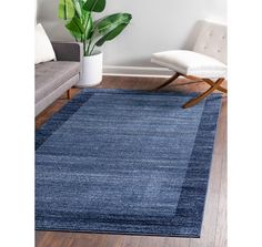 a blue area rug in a living room