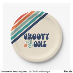 a paper plate with the words grooy and one on it in multicolored stripes