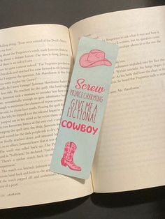 an open book with a pink cowboy hat on it and the words screw ranchering give me a traditional cowboy