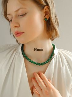 Experience Chinese elegance with our New Chinese Style Green Onyx Beaded Necklaces - harmonious compositions of high-quality agate beads ranging from 3mm to 12mm. Immerse yourself in nature and tranquility with the rich green hues, a symbol of harmony and balance. Metal: 18K Recycled Gold Plated On Brass Gemstone: Green Onyx Dimensions: 12/10/8/6mm Necklace Length: 400-450mm Weight: 80g/54g/36g/21g Elegant Jade Beaded Necklace With 8mm Beads, Elegant Beaded Necklaces With Round Beads For Meditation, Elegant Round Beaded Necklaces For Meditation, Elegant Jade Beaded Necklaces For Meditation, Sliver Earrings, Slider Necklace, Chic Rings, Chic Bracelet, Chic Necklace